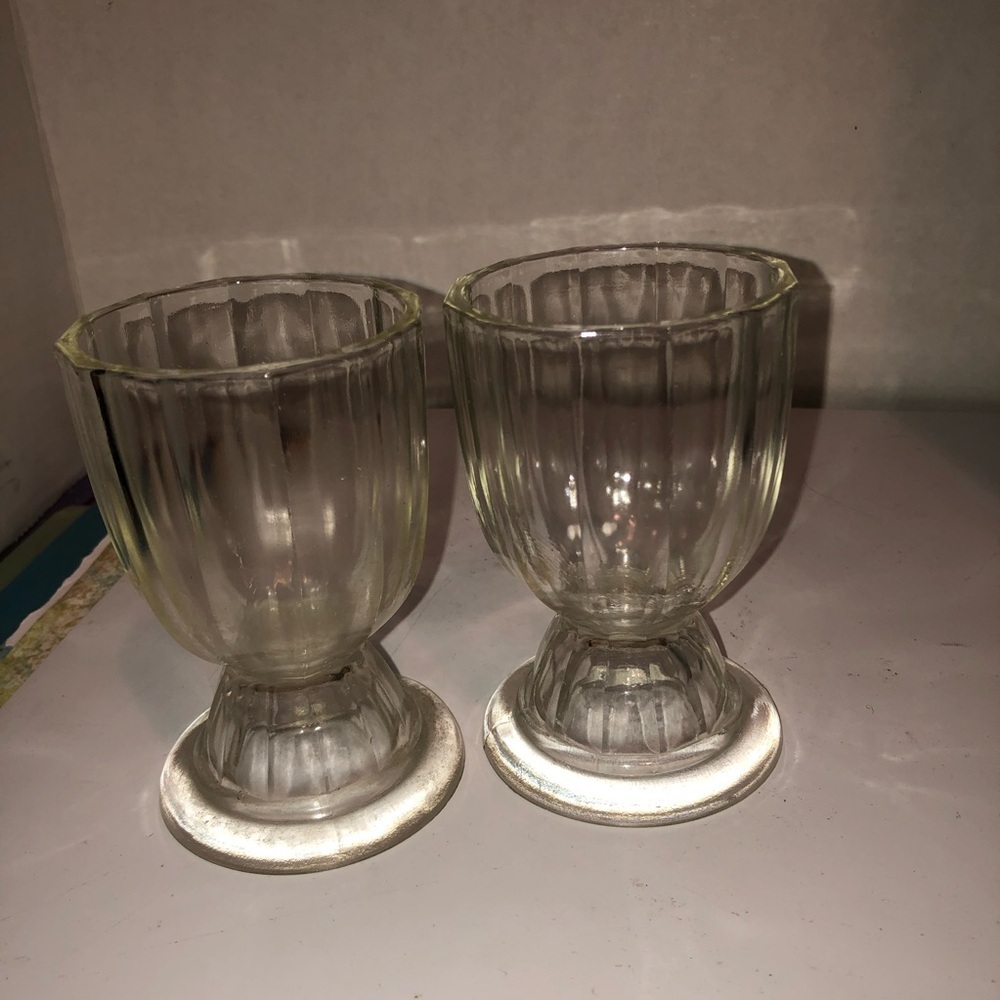 two vintage ribbed clear glass footed bowls/ glasses commonly used for ice cream